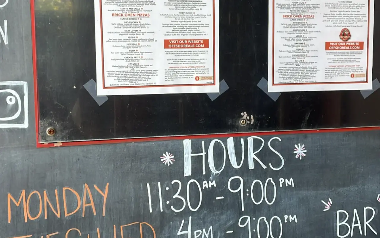 Chalkboard hours sign at Offshore Ale Company in Oak Bluffs