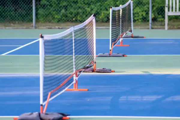 Portable pickleball nets set up across the courts