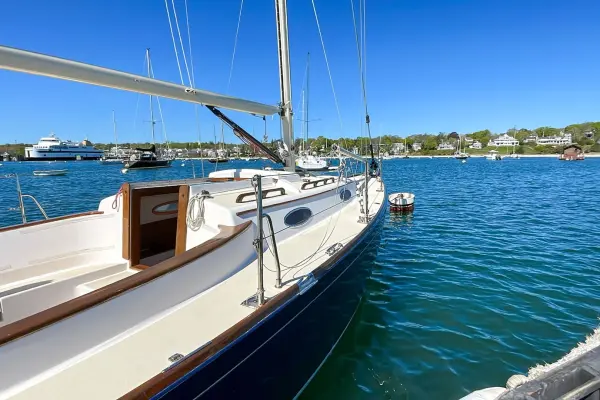 A classic sailboat moored in Vineyard Haven Harbor