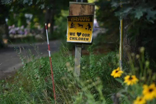 Slow down, we love our children: an up-island roadside sign