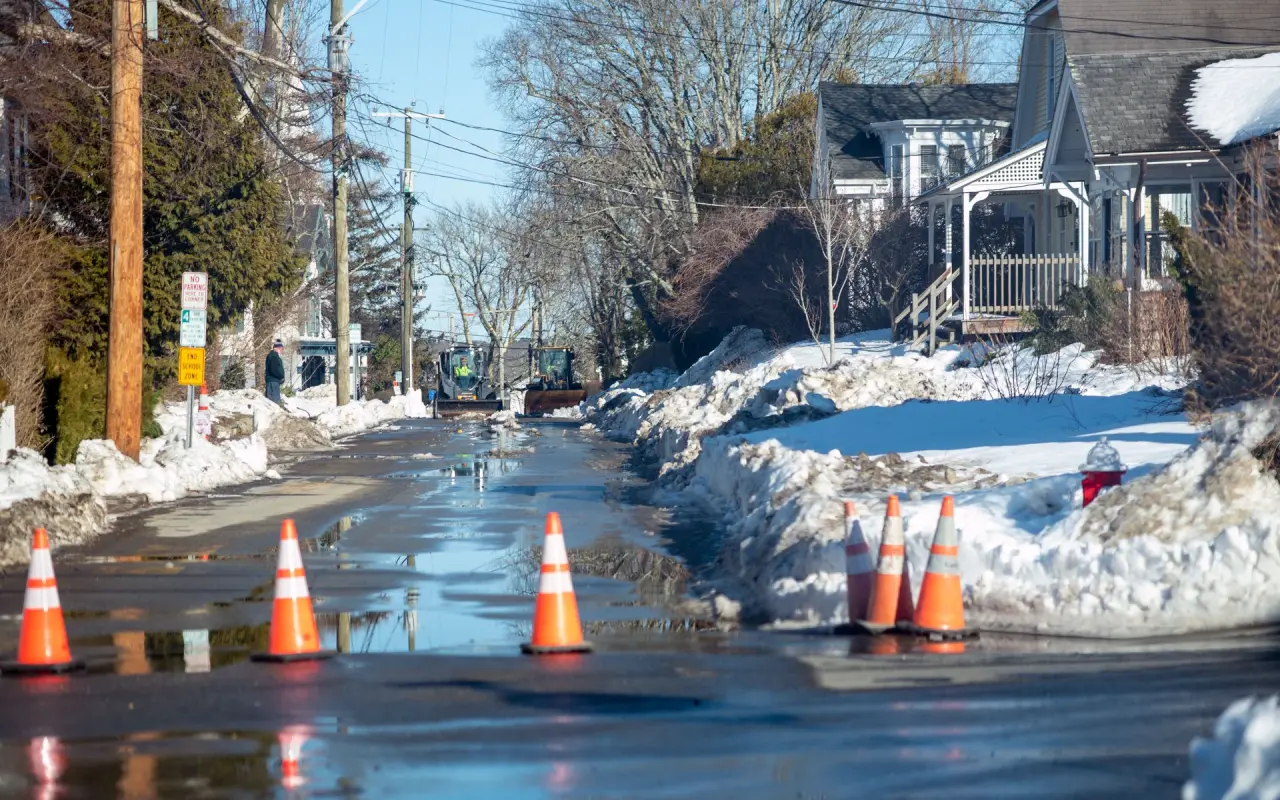 Traffic cones in slush on a plowed Vineyard Haven street