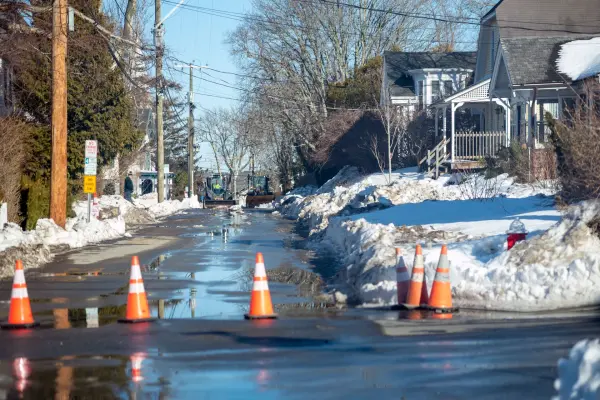 Traffic cones on a slushy Vineyard Haven street during cleanup