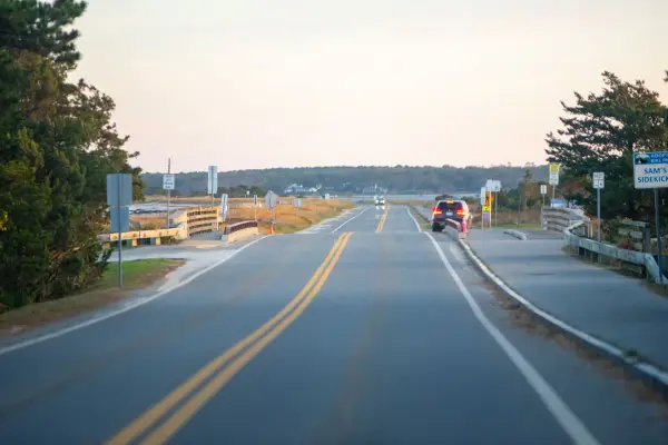 Driving along Beach Road toward State Beach at dusk