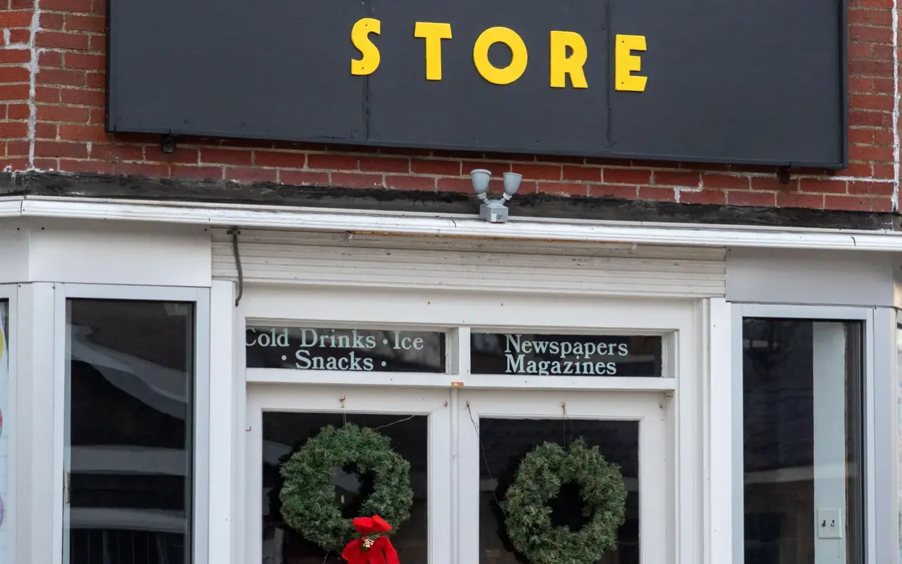 The Corner Store shopfront in Oak Bluffs with its yellow sign and wreaths in the windows