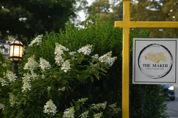 The Maker's sign tucked into the greenery