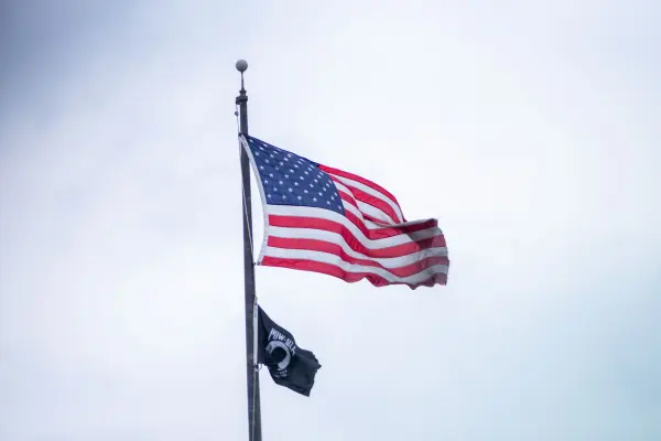 American and POW MIA flags flying on a flagpole