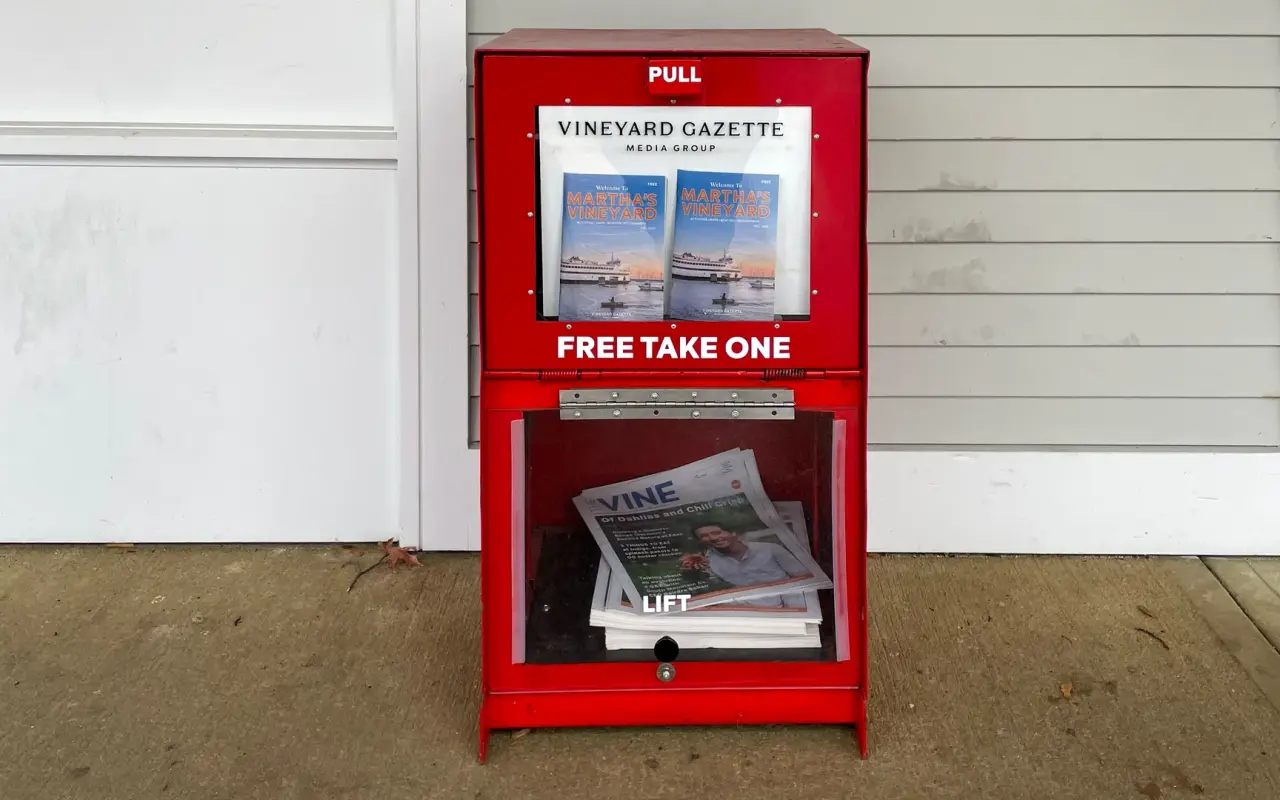 Red Vineyard Gazette newspaper box marked Free Take One on a porch