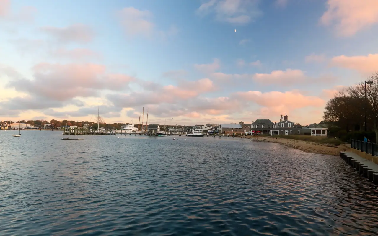 Vineyard Haven harbor at dusk with pink clouds and boats at their moorings