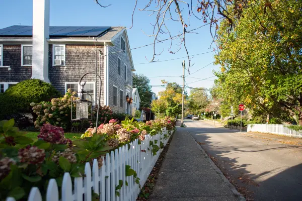 White picket fence and fall flowers along a Vineyard Haven sidewalk