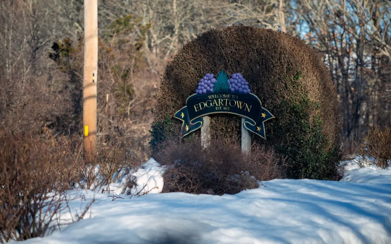 Welcome to Edgartown sign with snow on the ground in winter