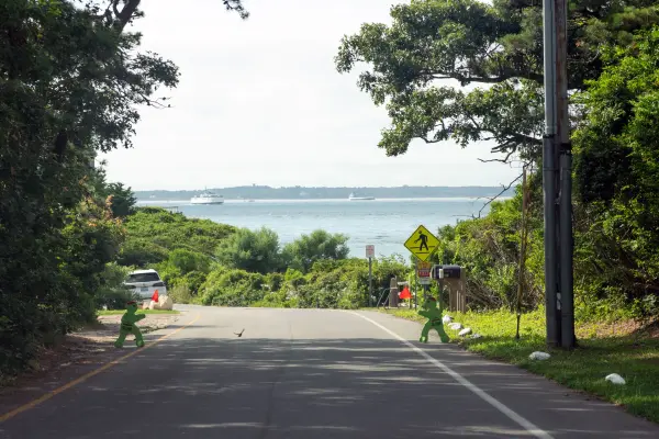 Road sloping down to the water at West Chop in summer