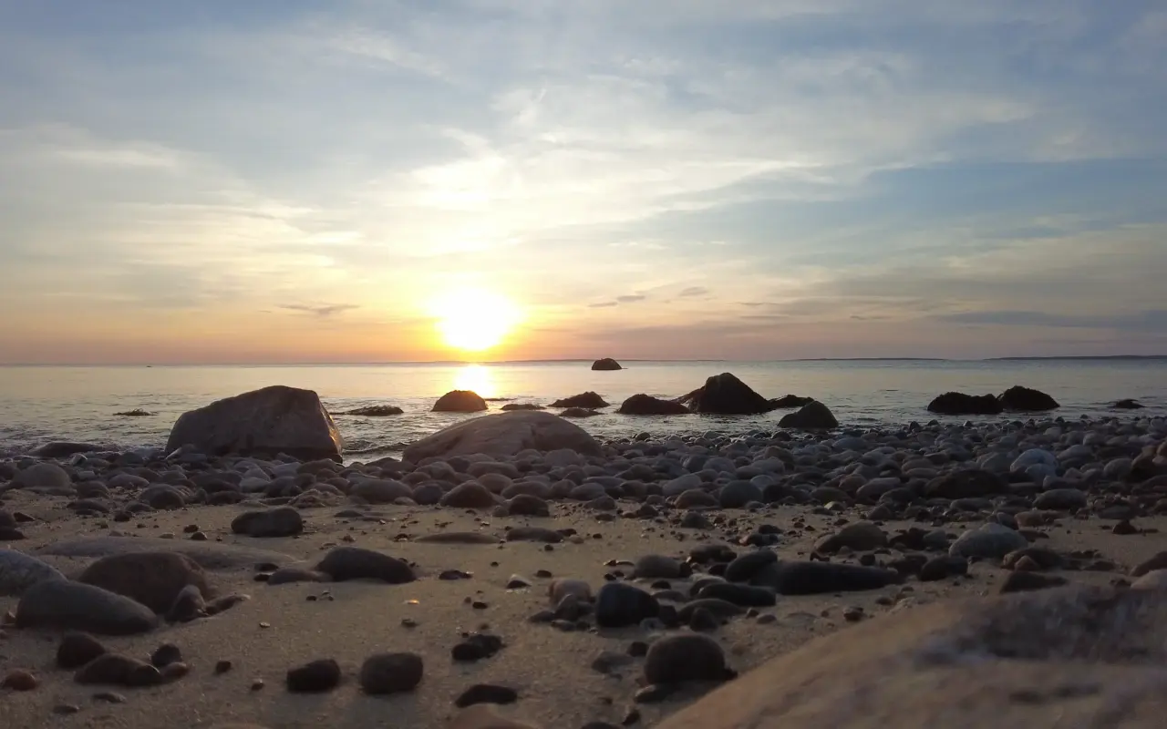 Rocky beach and Vineyard Sound at sunset in West Tisbury