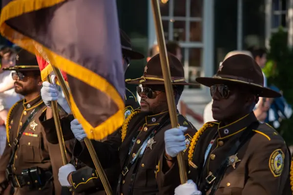 The Dukes County Sheriff's honor guard marching in the Edgartown Fourth of July parade