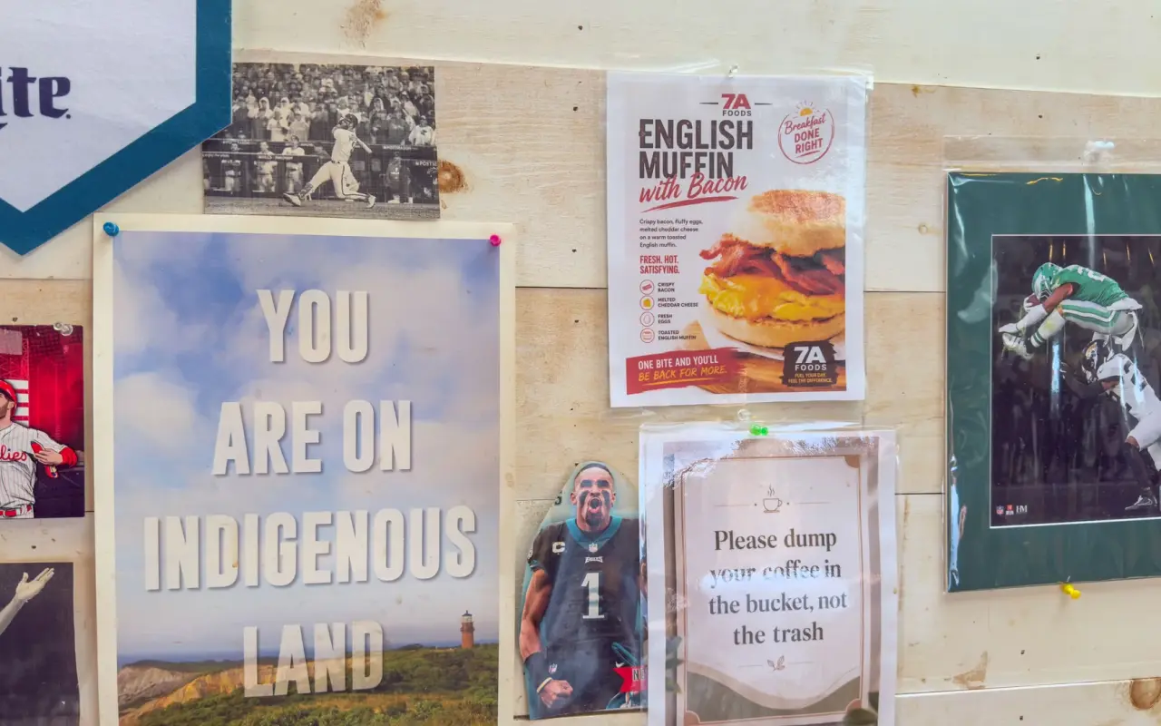 Posters at 7a Foods in West Tisbury including one reading You Are On Indigenous Land