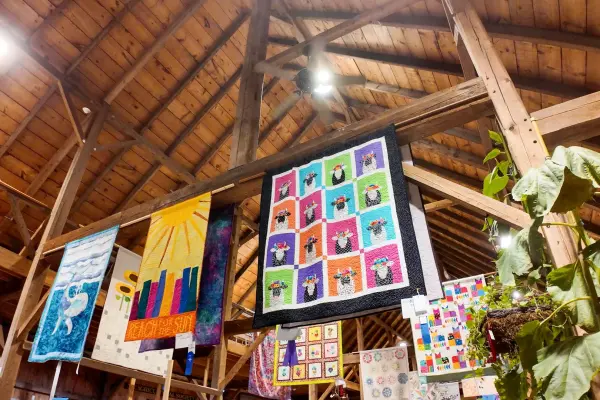 Quilts and artwork inside the Ag Hall