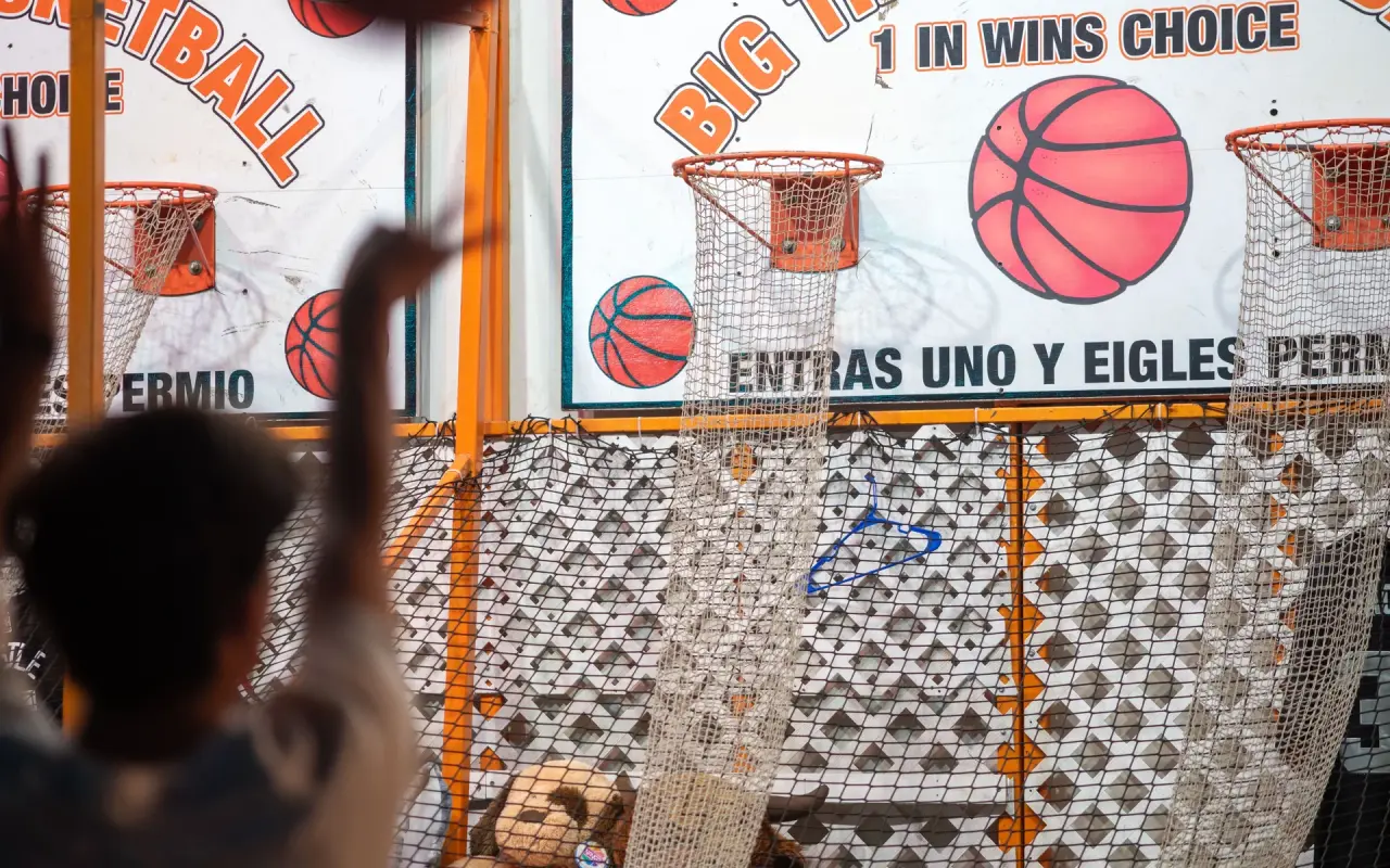 A player shoots at the basketball midway game at the Martha's Vineyard Agricultural Fair