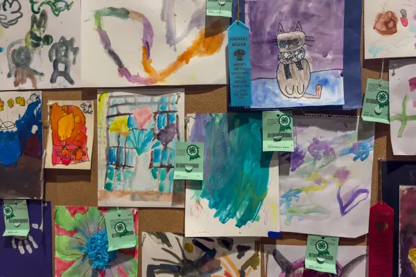 The junior art wall, where nearly every young painter takes home a ribbon
