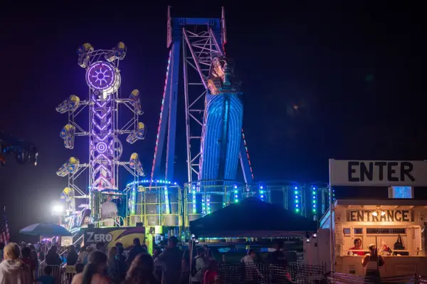 The full midway after dark, tickets sold at the entrance booth