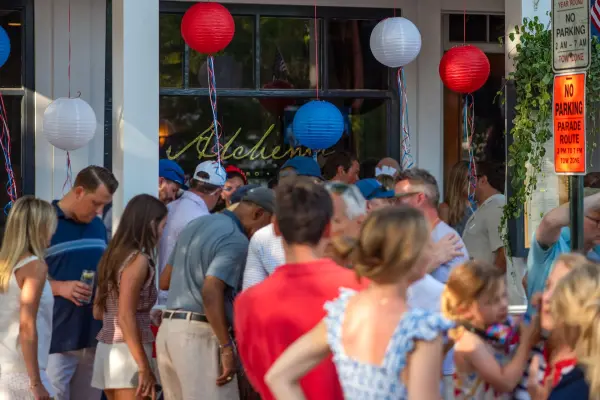 Alchemy bistro busy with paper lanterns along the parade route in Edgartown on the Fourth of July