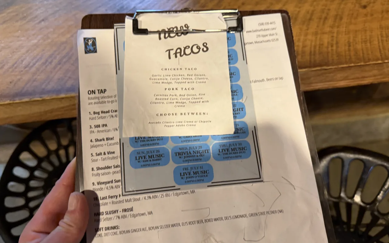 Bad Martha's brewery menu clipboard with tap list and live music schedule