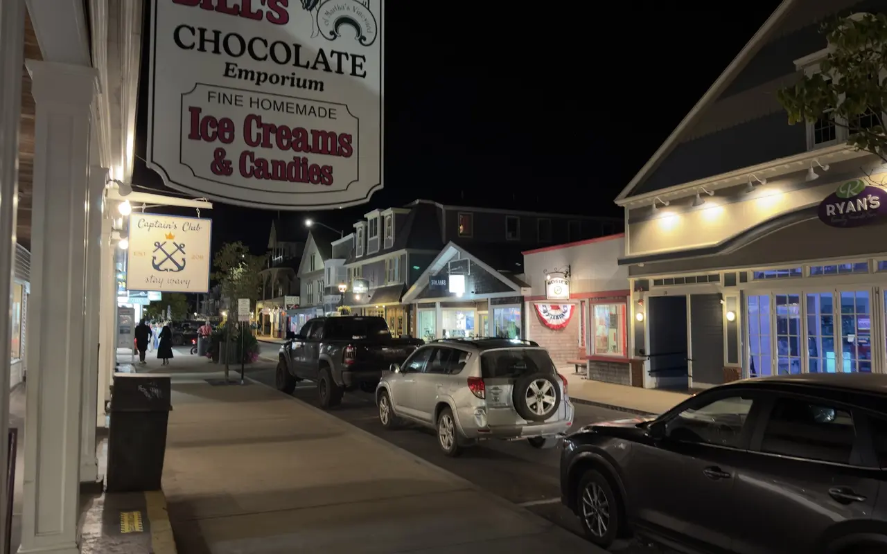 The Ben and Bill’s Chocolate Emporium sign on Circuit Avenue at night