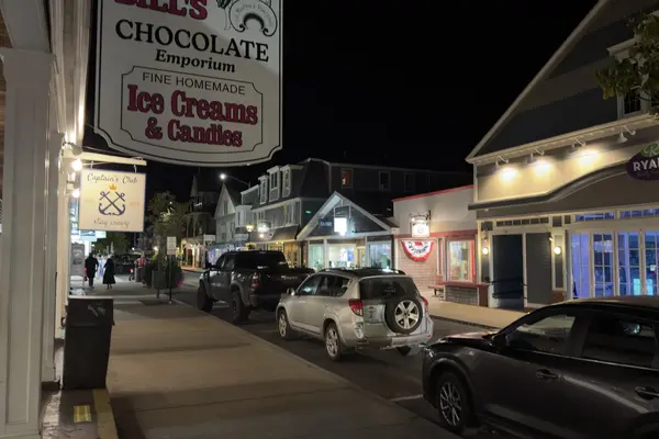 Ben and Bill's Chocolate Emporium sign lit over Circuit Avenue at night