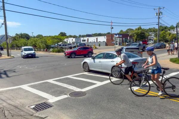 Cyclists crossing at Five Corners on a busy August afternoon