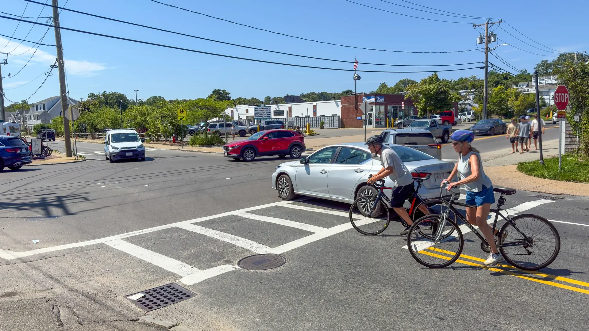 Cyclists crossing at Five Corners on a busy August afternoon