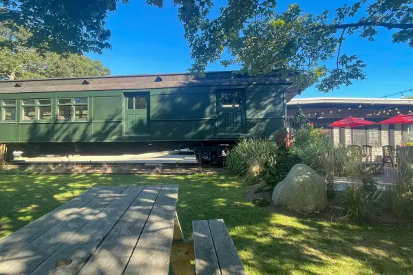 Vintage train car and outdoor seating at Black Dog Bakery Cafe