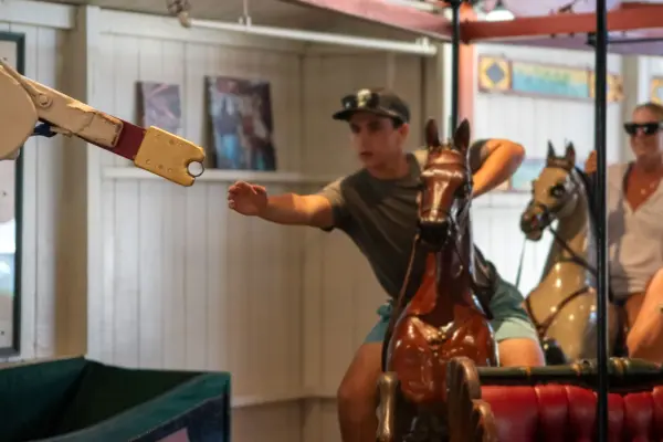 Reaching for the brass ring at the Flying Horses