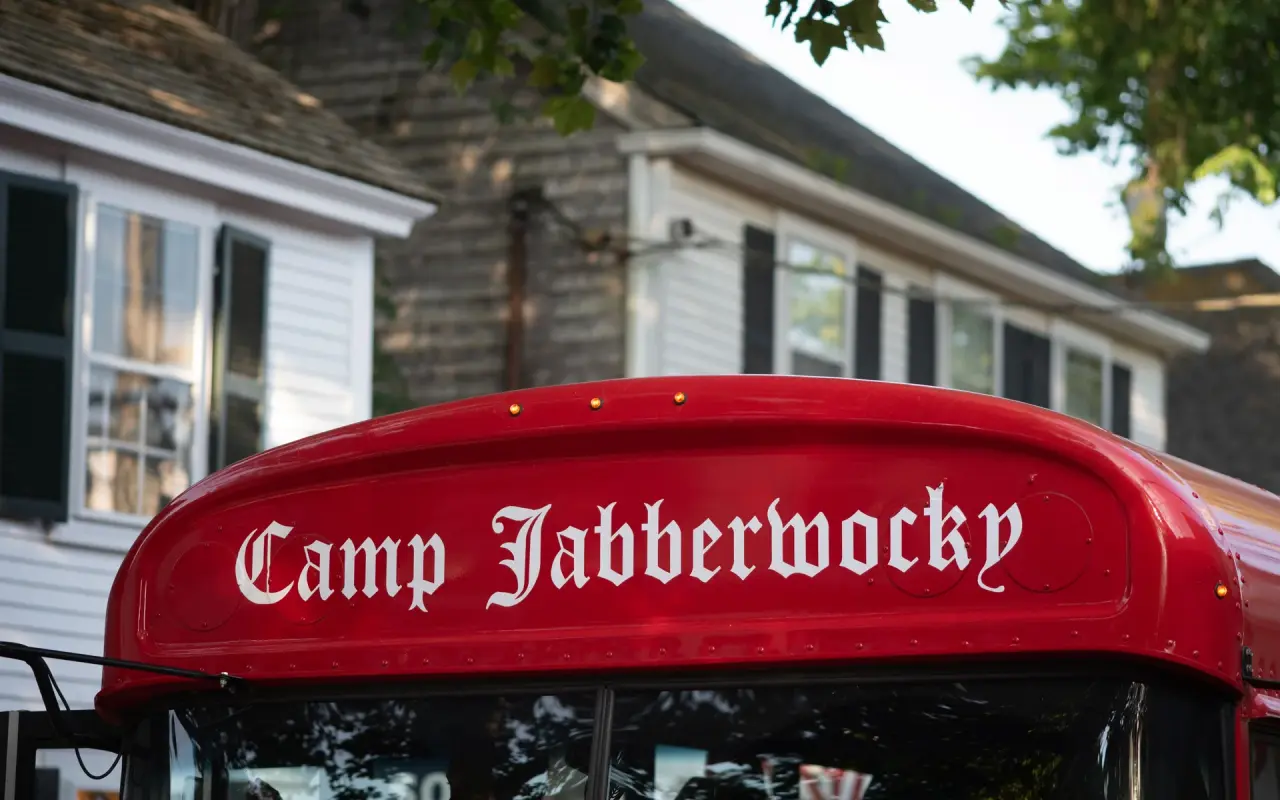 Camp Jabberwocky's red bus in the Edgartown Fourth of July parade