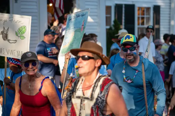 Camp Jabberwocky marchers with hand-painted island signs in the Edgartown Fourth of July parade