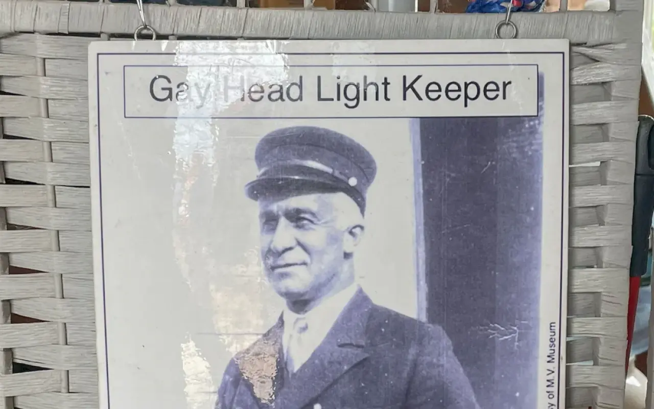 Sign with a historic photograph of Gay Head Light keeper Charles W. Vanderhoop