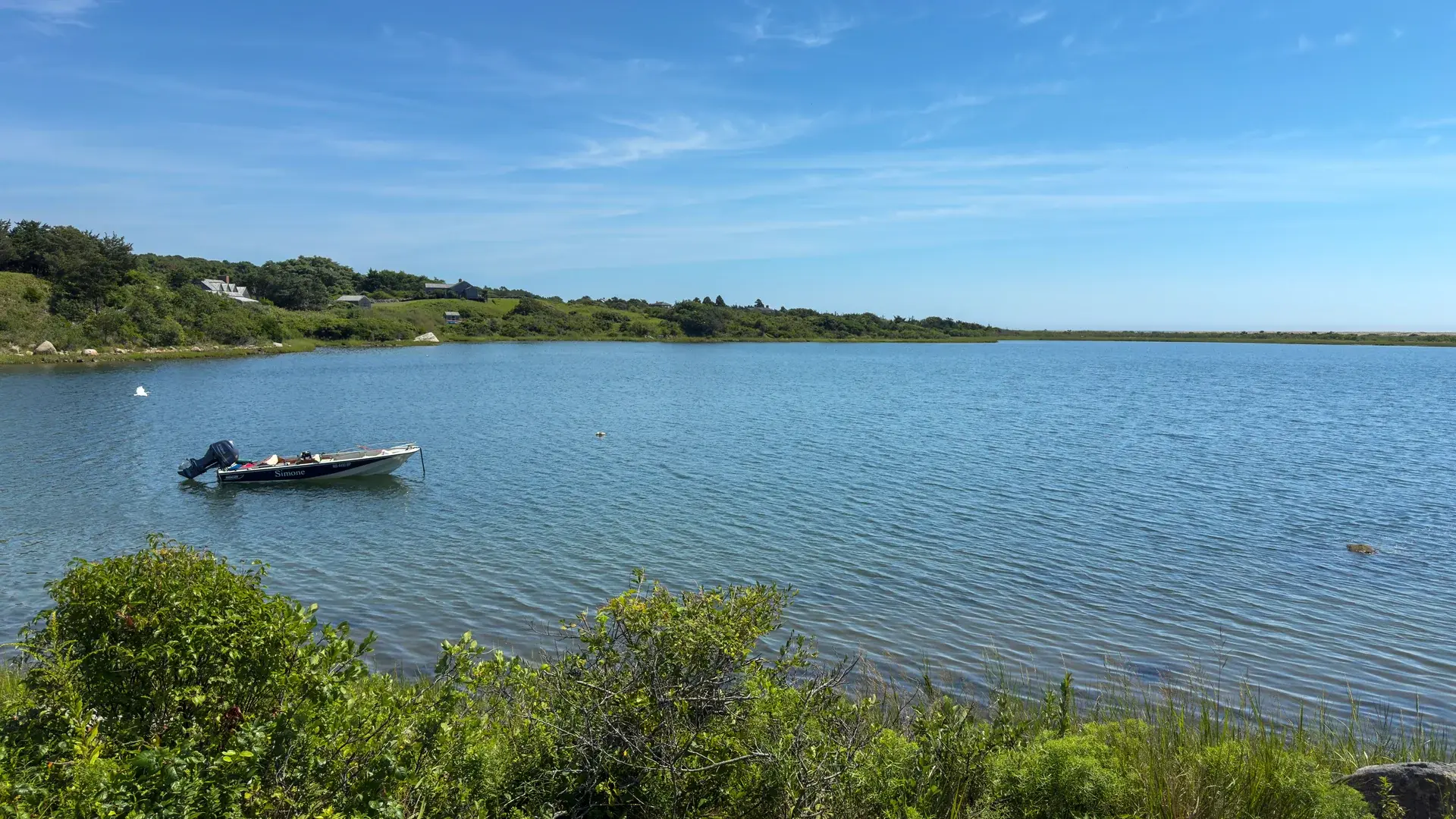 Chilmark Pond on a windless morning, one skiff and no crowd