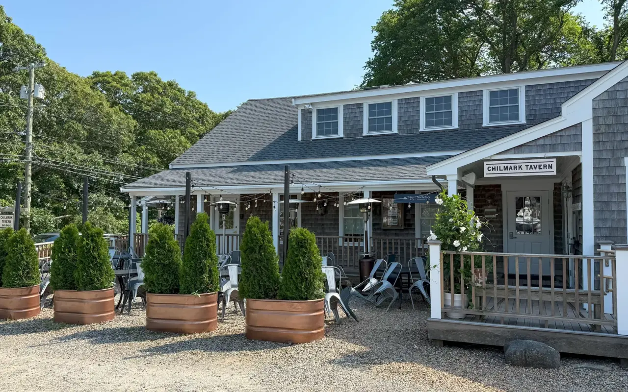 Chilmark Tavern patio with planters and outdoor seating on State Road