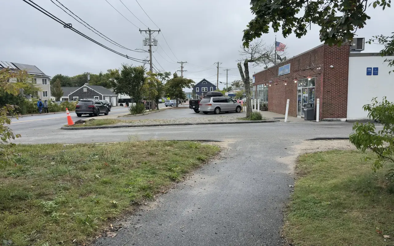 Cumberland Farms, a red-brick store with an American flag, near Five Corners in Vineyard Haven on a gray September day