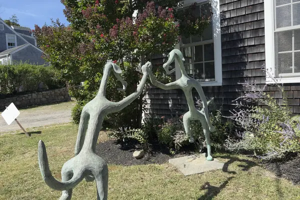 Two dancing figures, a front-garden sculpture in Vineyard Haven