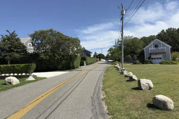 An East Chop road lined with boulders and shingled houses