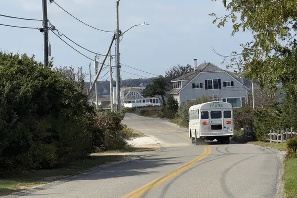 A tour bus on an East Chop road in October