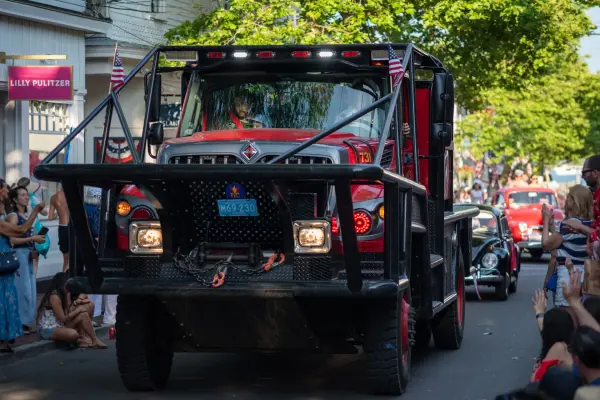 A large fire-rescue truck rolling through the Edgartown Fourth of July parade