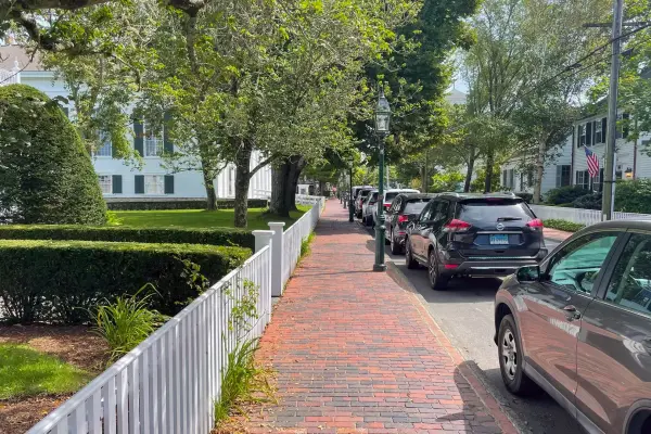 Brick sidewalk and parked cars on Main Street, Edgartown