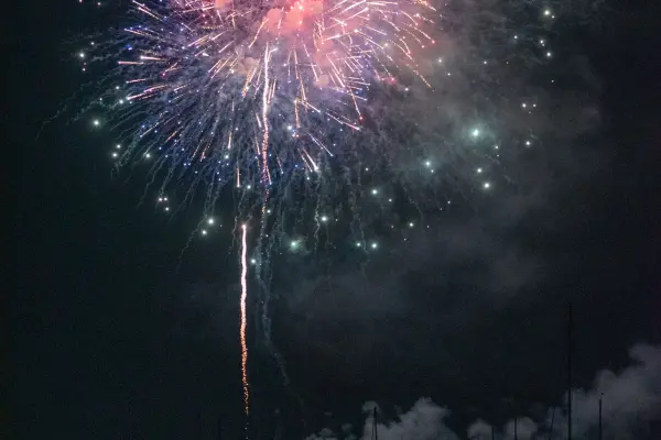 A pink-and-green firework burst over Edgartown Harbor, Fourth of July 2026