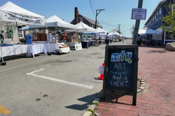 A First Friday chalkboard on Beach Street Extension