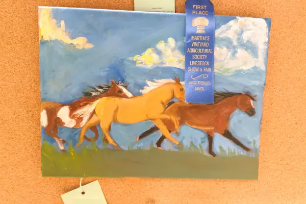 A first place ribbon for this painting of three horses at full run