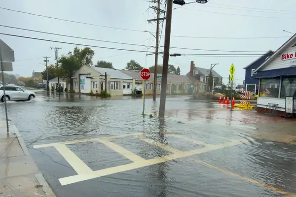 Five Corners under water in the September 26, 2026 nor'easter, sandbags outside Martha's Bike