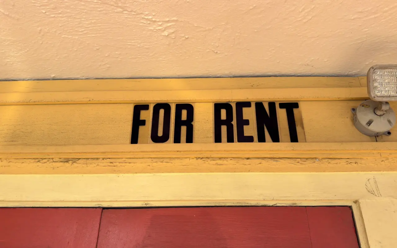 Hand-painted For Rent sign above a doorway on Martha’s Vineyard