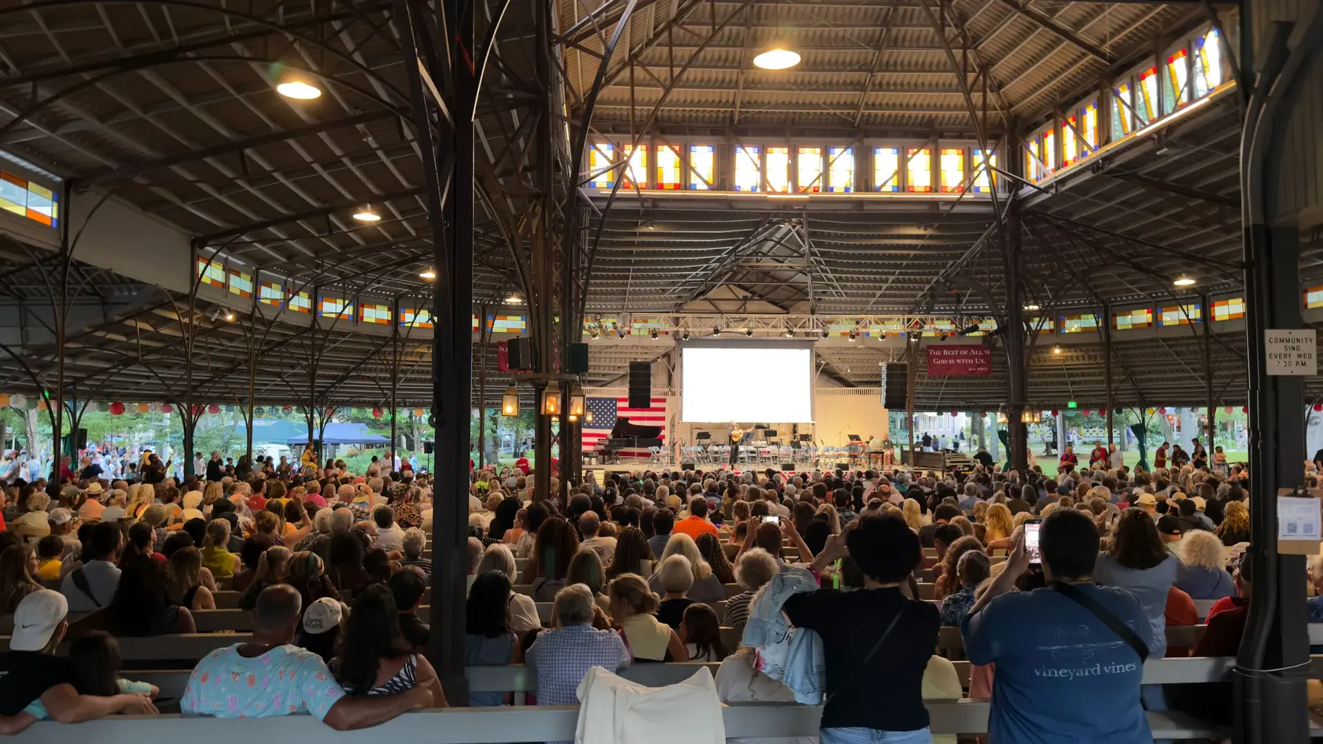 Benches full before dark for the sing and the Community Award
