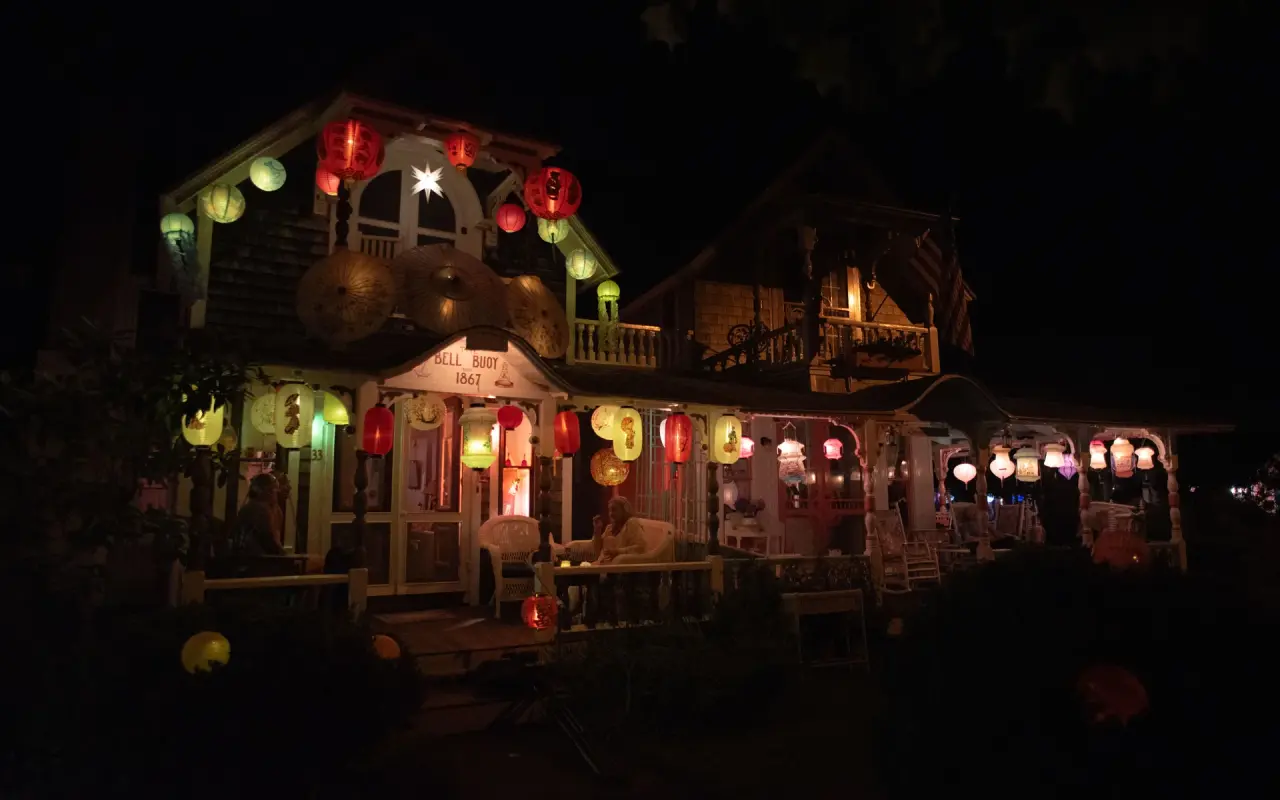 Gingerbread cottages in the Oak Bluffs Campground lit with paper lanterns at night