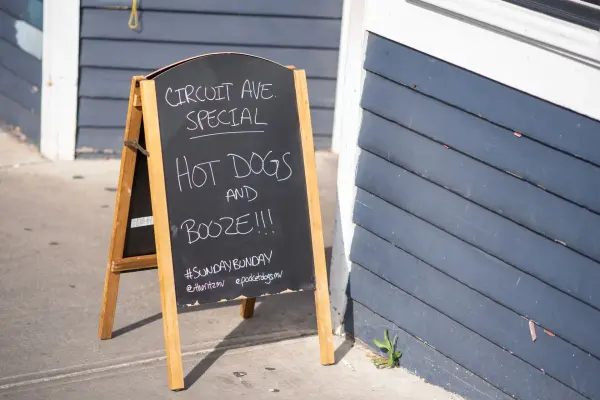 Hot dogs and booze special on the chalkboard at The Ritz
