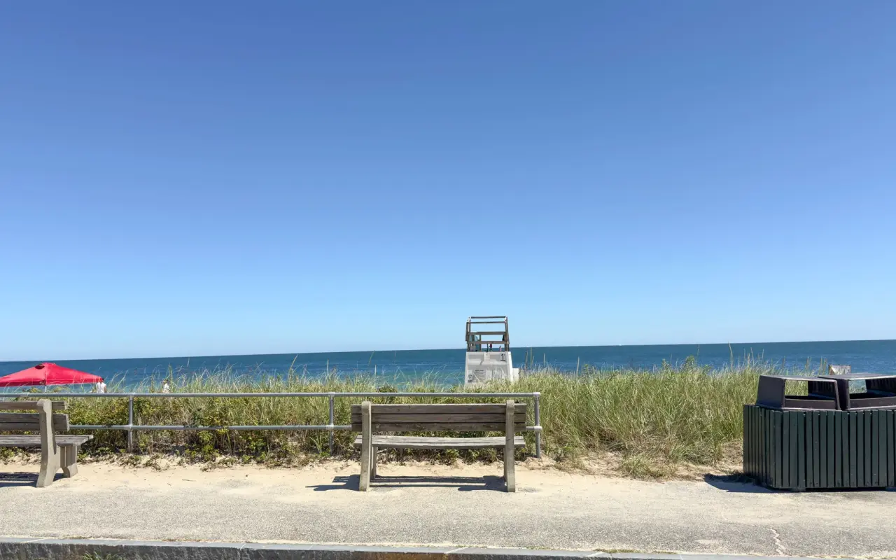 Inkwell Beach in Oak Bluffs on a sunny day with an empty lifeguard stand and calm water